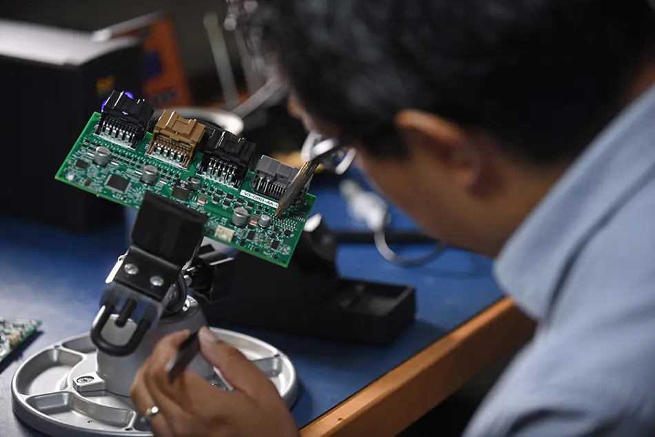 Person working with circuits and circuit board