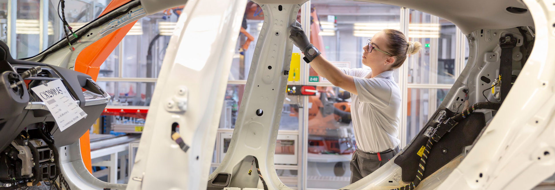 woman working on a car